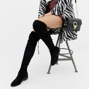 Thigh high flat boots